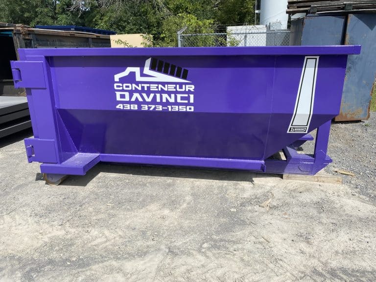 Purple industrial dumpster labelled Conteneur Davinci with contact number 438 373-1350 outdoors on gravel surface
